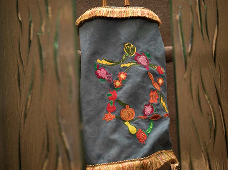 Beautifully embroidered Torah cover with tassles