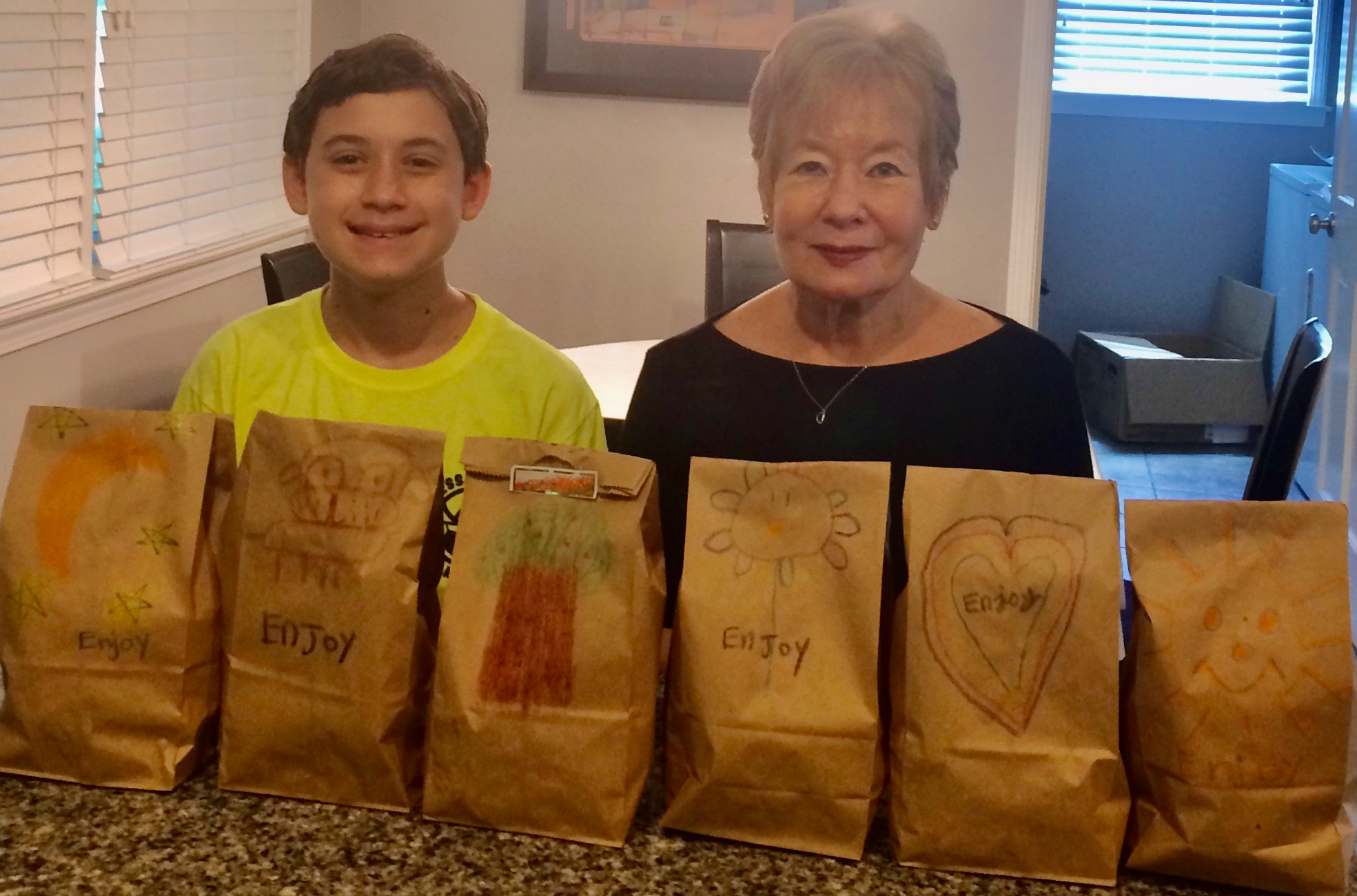 Dianne Jaslow and Joshua Weiss making lunches for Mary Hall Freedom House