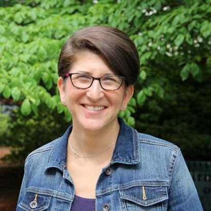 Beth Blick, director of religious school headshot with glasses.