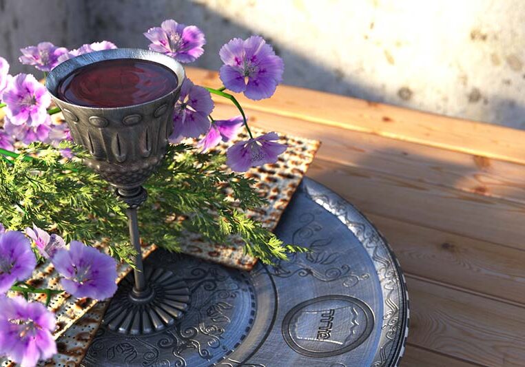 passover seder plate with matzo and flowers holiday background