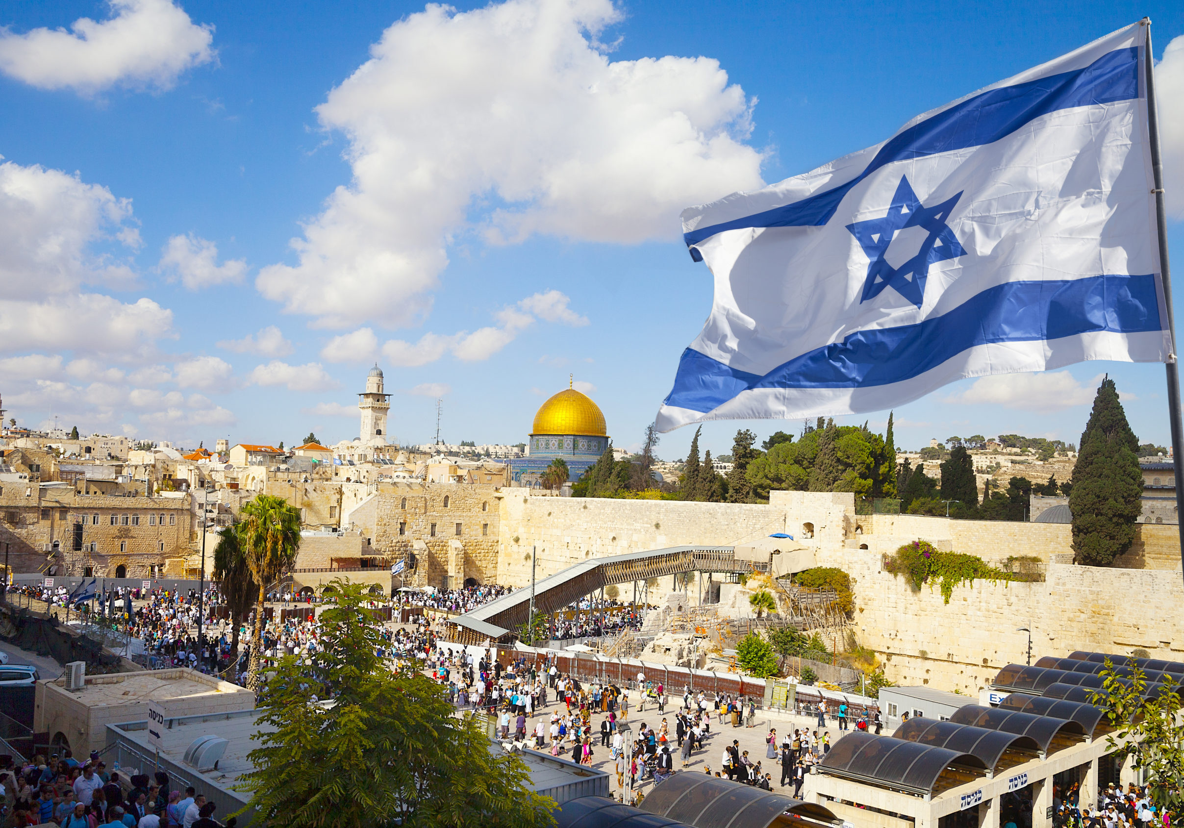 Israel flag with a view of old city Jerusalem and the KOTEL- Western wall